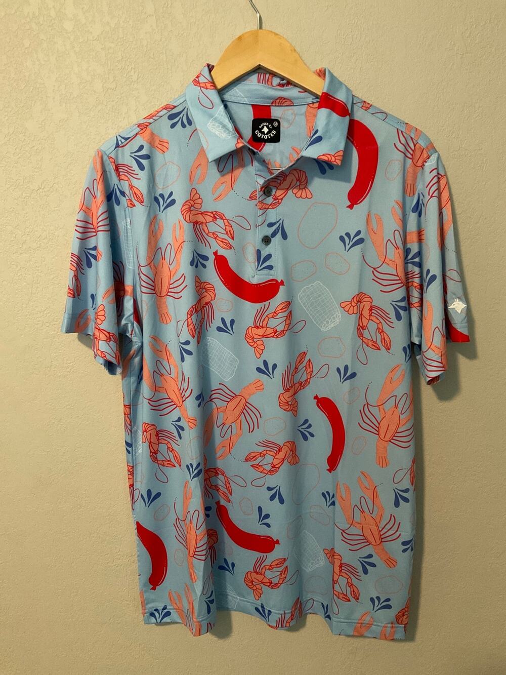 Raised by Coyotes “Crawfish Boil” Light Blue Men’s Polo, M